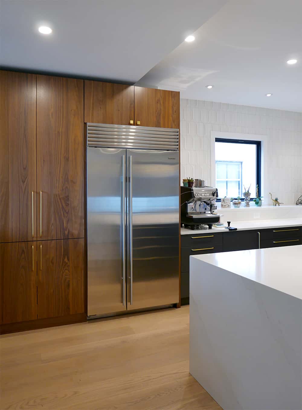 View of built-in refrigerator and cabinetry