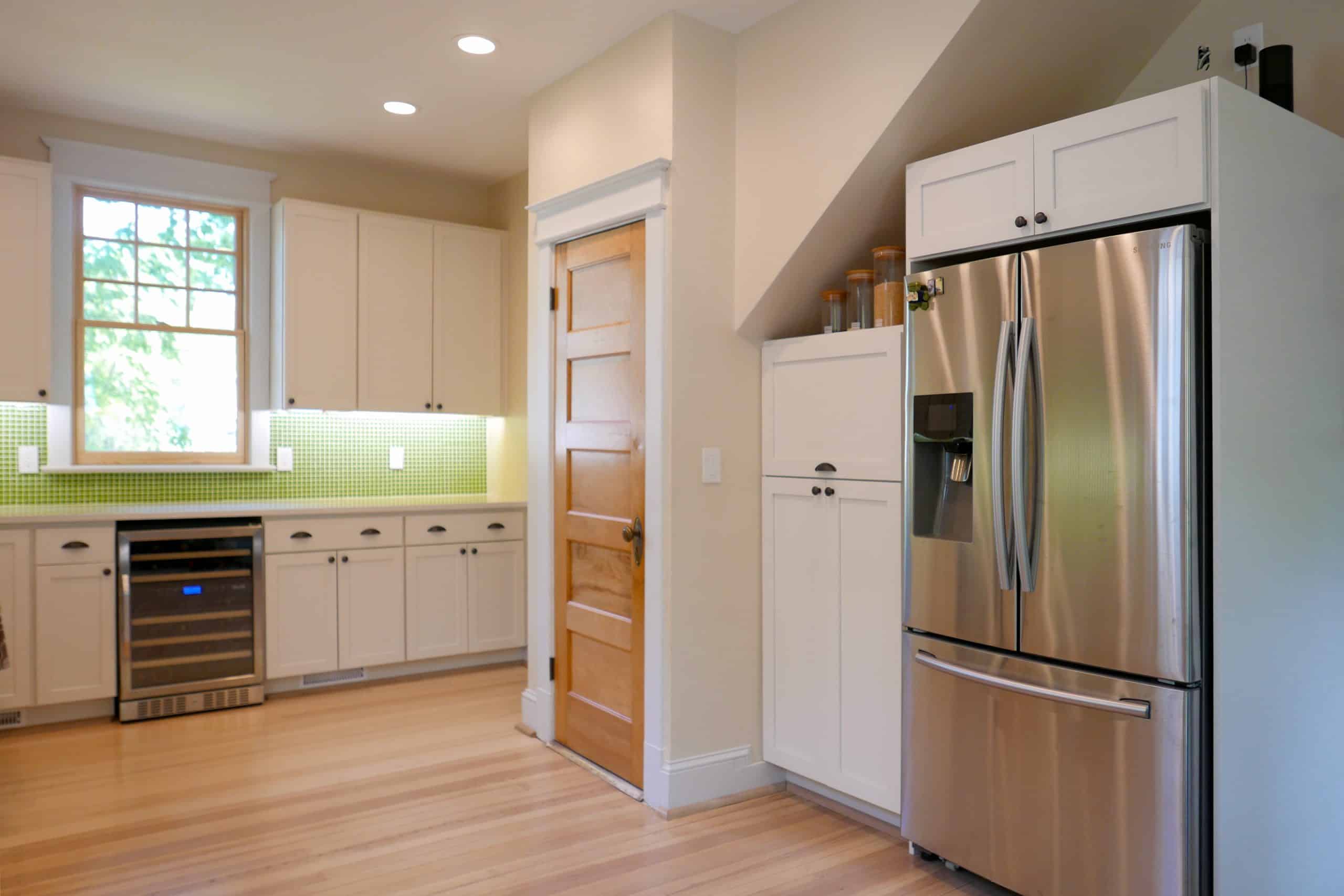 view of the Laurel residence kitchen refrigerator and wine fridge